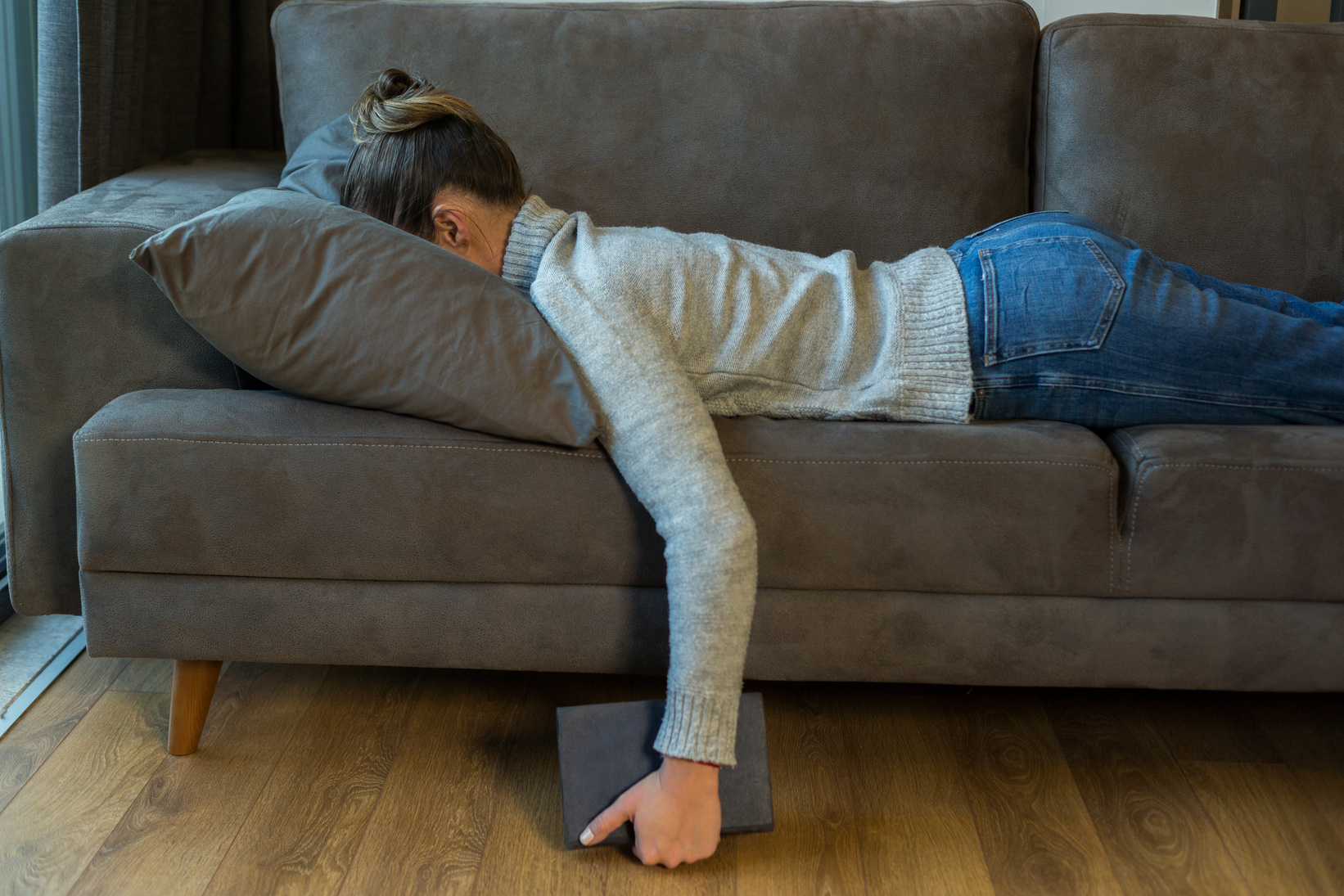 Tired woman sleep on sofa